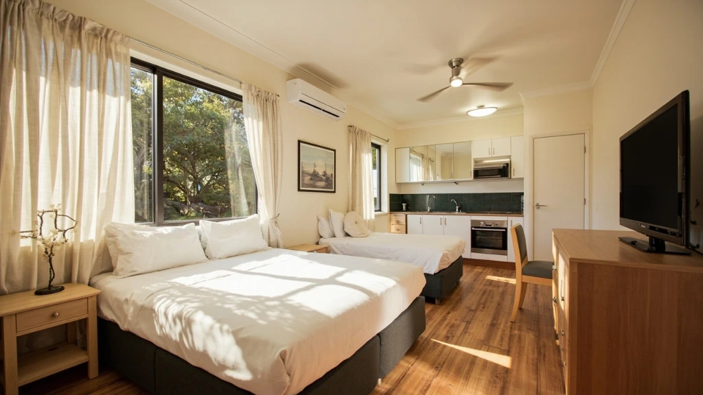 Twin studio with queen bed, single bed and full kitchenette.